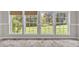 Sunroom featuring natural light, tile floors and backyard views at 1975 Old Wilkesboro Rd, Taylorsville, NC 28681