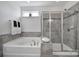 Bathroom features a large soaking tub and a walk-in shower at 20202 Dovekie Ln, Indian Land, SC 29707