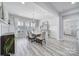 Elegant dining room with decorative lighting and large windows at 20202 Dovekie Ln, Indian Land, SC 29707