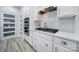 Bright kitchen showcases stainless steel appliances, white cabinetry, and a modern design at 20202 Dovekie Ln, Indian Land, SC 29707