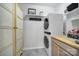 Well-organized laundry room with stackable washer/dryer and ample storage space at 20202 Dovekie Ln, Indian Land, SC 29707