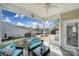 Relaxing screened porch with comfortable seating and views of the backyard at 20202 Dovekie Ln, Indian Land, SC 29707
