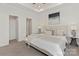 Bright main bedroom featuring tray ceiling, neutral decor, and private ensuite access at 212 S Columbia St, Gastonia, NC 28054