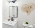 Bathroom featuring a white sink vanity and modern faucet and mirror at 2138 Syracuse Dr, Charlotte, NC 28216