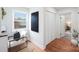 Hallway with wood floors, a small reading nook with natural lighting, and a double door closet at 2138 Syracuse Dr, Charlotte, NC 28216