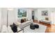 Bright living room with hardwood floors, modern decor, and plenty of natural light at 2138 Syracuse Dr, Charlotte, NC 28216