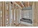 Unfinished bathroom featuring exposed framing and a new bathtub at 2628 S Main St, Kannapolis, NC 28027