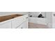 Bathroom featuring white cabinets, black hardware, and a pristine white bathtub, creating a serene space at 2628 S Main St, Kannapolis, NC 28027