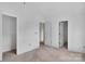 Unfinished bedroom with neutral walls, ample natural light, and multiple doorways, perfect for personalization at 2628 S Main St, Kannapolis, NC 28027