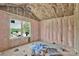 An unfinished bedroom with vaulted ceilings and insulation, awaiting your personal touch and design at 2628 S Main St, Kannapolis, NC 28027