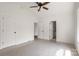 Bedroom with a ceiling fan and two doorways, offering a bright and open feel at 2628 S Main St, Kannapolis, NC 28027