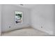 Empty bedroom with a window at 2628 S Main St, Kannapolis, NC 28027