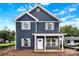 Charming two-story home with blue siding, white trim, and a welcoming front porch on a sunny day at 2628 S Main St, Kannapolis, NC 28027
