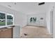 Bright kitchen featuring white cabinets and modern design elements with a large window offering plenty of natural light at 2628 S Main St, Kannapolis, NC 28027