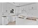 Unfinished kitchen featuring pristine white cabinets, black hardware, and plenty of storage, ready to customize at 2628 S Main St, Kannapolis, NC 28027