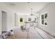 Bright kitchen with white cabinetry, granite countertops, an island, and view to back yard at 2628 S Main St, Kannapolis, NC 28027