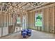 Unfinished living room with exposed framing and windows before installation of drywall at 2628 S Main St, Kannapolis, NC 28027