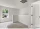 Upstairs loft area with natural light, white walls, carpet, and stair railing at 2628 S Main St, Kannapolis, NC 28027
