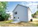 Back exterior of home featuring new siding, a small patio and a grassy backyard at 2628 S Main St, Kannapolis, NC 28027