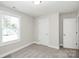 Bright bedroom with neutral walls, cozy carpet, and a window bringing in natural light at 2628 S Main St, Kannapolis, NC 28027