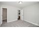 A comfortable bedroom has an open doorway to another room at 2628 S Main St, Kannapolis, NC 28027