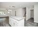 Modern kitchen featuring white cabinets, granite countertops, and a central island at 2628 S Main St, Kannapolis, NC 28027