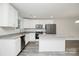 Modern kitchen with stainless appliances, granite counters, and large kitchen island at 2628 S Main St, Kannapolis, NC 28027