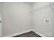 A well-lit laundry room features modern hookups and storage shelves at 2628 S Main St, Kannapolis, NC 28027