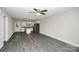Open-concept living room featuring hardwood floors and flowing seamlessly into the kitchen at 2628 S Main St, Kannapolis, NC 28027