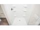 Inside a clean and bright white stand-up shower with built-in shelving at 2628 S Main St, Kannapolis, NC 28027