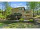 The backyard features a spacious deck, patio, and lush greenery, perfect for outdoor entertaining and relaxation at 273 S Downs Way, Fort Mill, SC 29708