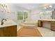 Bathroom featuring a large soaking tub, marble countertops and natural lighting at 273 S Downs Way, Fort Mill, SC 29708