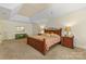 Bedroom featuring a trey ceiling, access to walk-in closet and accent chest of drawers at 273 S Downs Way, Fort Mill, SC 29708
