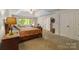 Bedroom featuring a trey ceiling, access to walk-in closet and upholstered chairs at 273 S Downs Way, Fort Mill, SC 29708