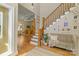 Bright and welcoming foyer with hardwood floors, staircase, and views of the living room at 273 S Downs Way, Fort Mill, SC 29708