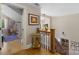 Open hallway featuring wood floors and a decorative staircase at 273 S Downs Way, Fort Mill, SC 29708