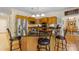 Charming kitchen featuring a breakfast bar with seating, stainless steel appliances, and ample cabinet space at 273 S Downs Way, Fort Mill, SC 29708