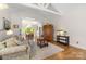 Open-concept living room with hardwood floors and views into the dining area at 273 S Downs Way, Fort Mill, SC 29708