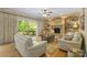 Inviting living room with fireplace, built-in shelving, and sliding glass doors leading to the outdoor deck at 273 S Downs Way, Fort Mill, SC 29708