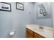 Elegant half-bath with modern sink, framed mirror, and coastal decor at 2756 Von Thuringer Ct, Charlotte, NC 28210