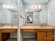 Bathroom featuring a double vanity with ample lighting and a large mirror at 2756 Von Thuringer Ct, Charlotte, NC 28210