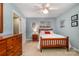 Comfortable bedroom featuring a wooden bed frame, side table, and blue walls at 2756 Von Thuringer Ct, Charlotte, NC 28210