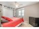 Bright bedroom featuring neutral walls, a ceiling fan, and built-in shelving above the closet at 2756 Von Thuringer Ct, Charlotte, NC 28210