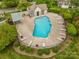 Community pool with lounge chairs and lush landscaping at 2756 Von Thuringer Ct, Charlotte, NC 28210