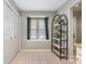 Bright dining area features a large window and modern shelving unit at 2756 Von Thuringer Ct, Charlotte, NC 28210