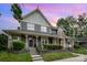 Charming two-story home with a covered front porch and landscaped front yard at 2756 Von Thuringer Ct, Charlotte, NC 28210