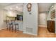 Inviting kitchen features a breakfast bar with granite countertops and white cabinets at 2756 Von Thuringer Ct, Charlotte, NC 28210