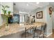 Cozy kitchen with granite countertops, breakfast bar and stainless steel sink at 2756 Von Thuringer Ct, Charlotte, NC 28210