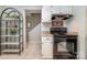 Galley-style kitchen with modern black appliances and stylish shelving unit at 2756 Von Thuringer Ct, Charlotte, NC 28210