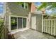 Back patio with sliding glass doors, siding, and a white exterior door at 2756 Von Thuringer Ct, Charlotte, NC 28210